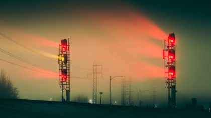 red traffic light during sunset