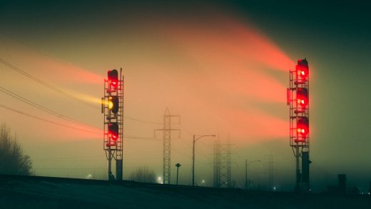 red traffic light during sunset