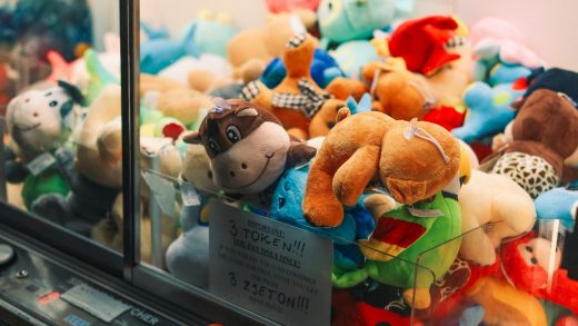 a display case filled with lots of stuffed animals